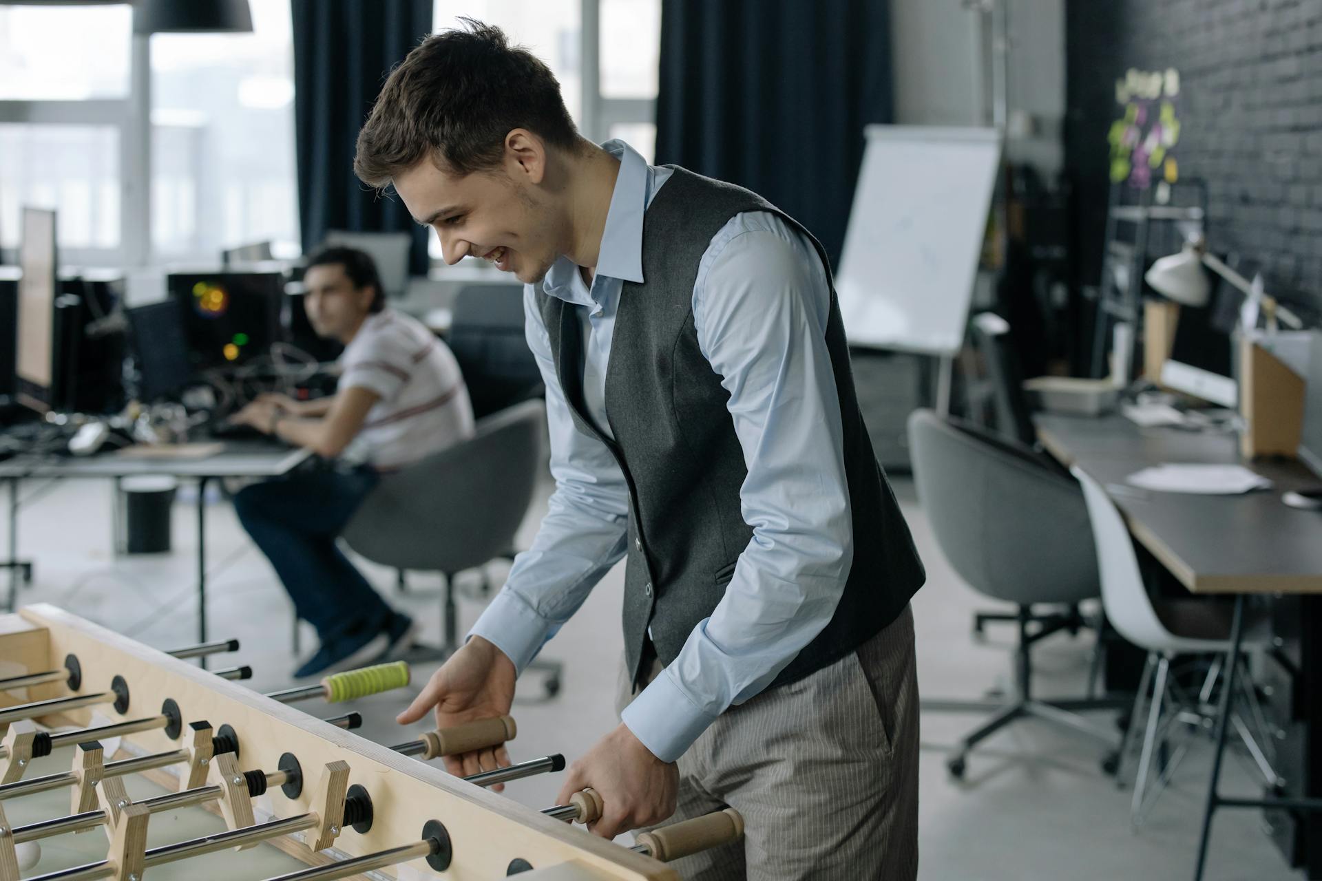 Photo by cottonbro studio: https://www.pexels.com/photo/young-employee-playing-foosball-6804583/ for a blog on Engage360 Employee Engagement Software: Psychometric, Proven & Scalable